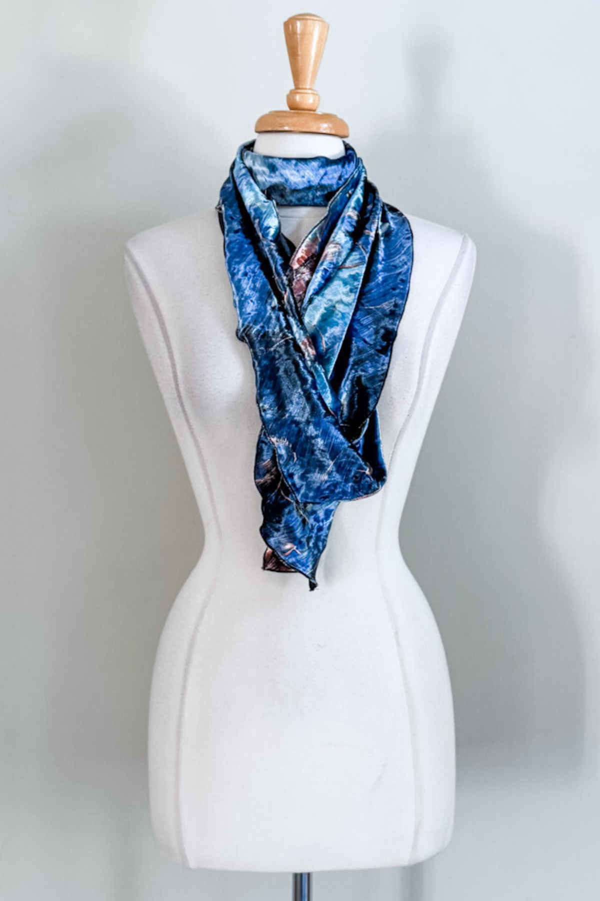 Blue marble-patterned sash worn as a scarf from Diane Kroe