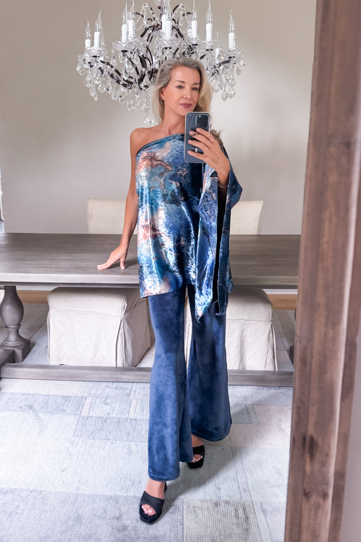 Diane Kroe wearing the Blue Marble Endless dress worn as a stylish top from the Velvet Collection