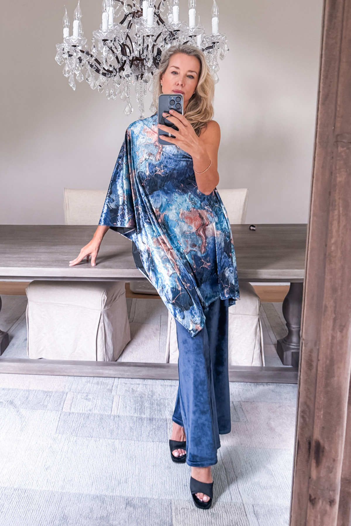 Diane Kroe wearing the Blue Marble Endless dress worn as a stylish top from the Velvet Collection