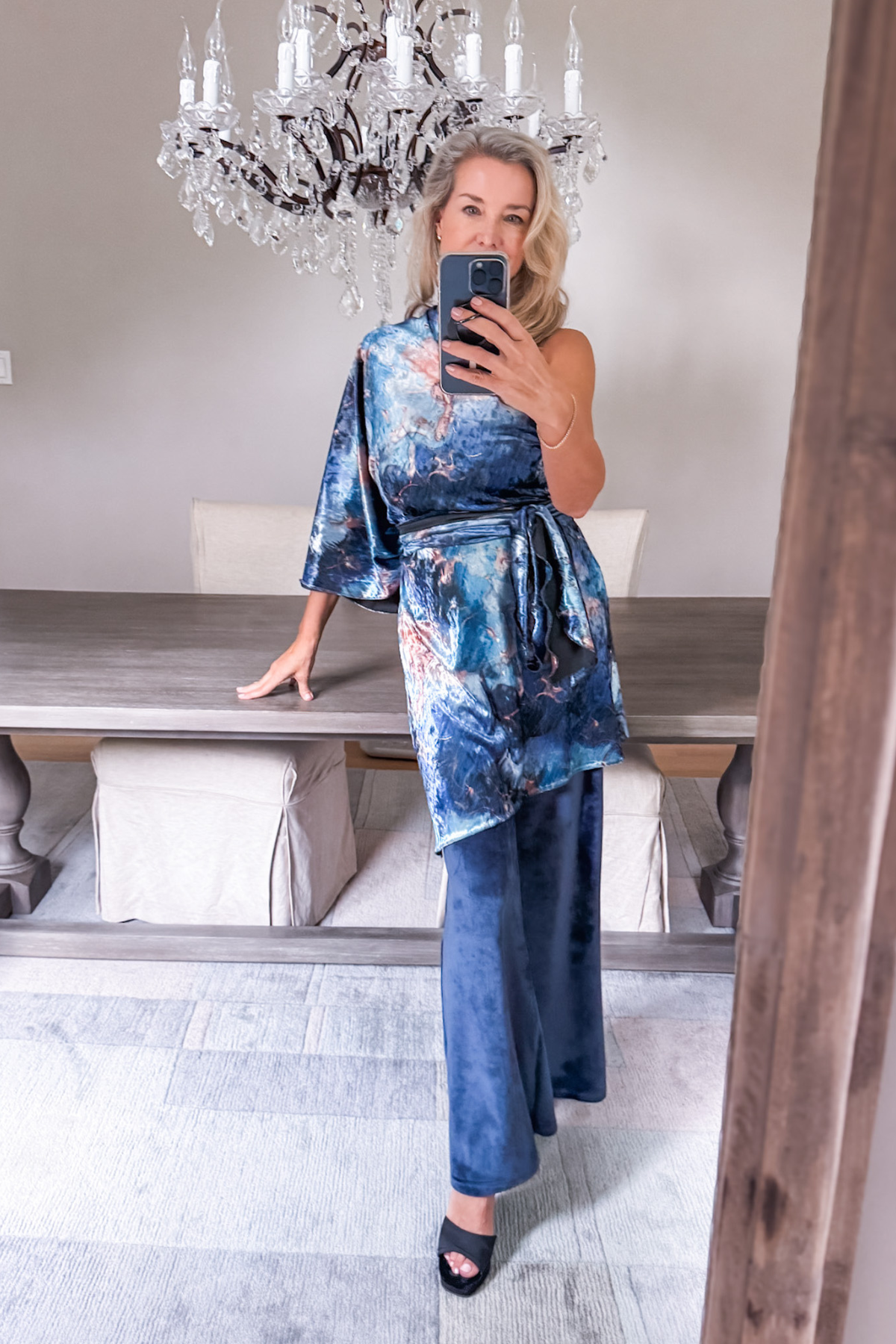 Diane Kroe wearing the Blue Marble Endless dress worn as a stylish top from the Velvet Collection