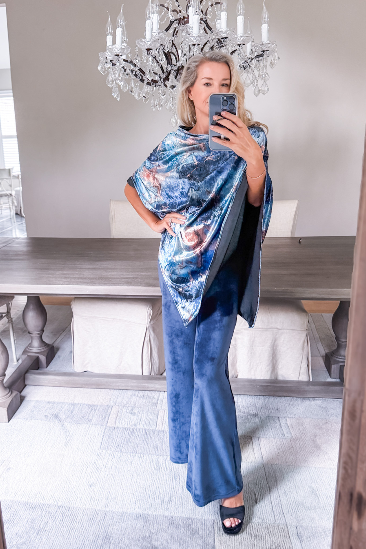 Diane Kroe wearing the Blue Marble Endless dress worn as a stylish top from the Velvet Collection