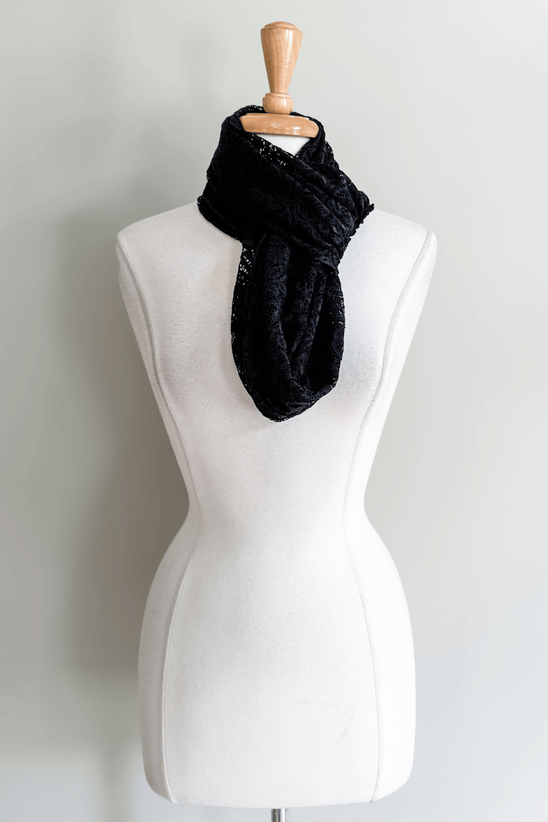 Diane Kroe Black Lace Mantilla Wrap styled as a knotted neck scarf