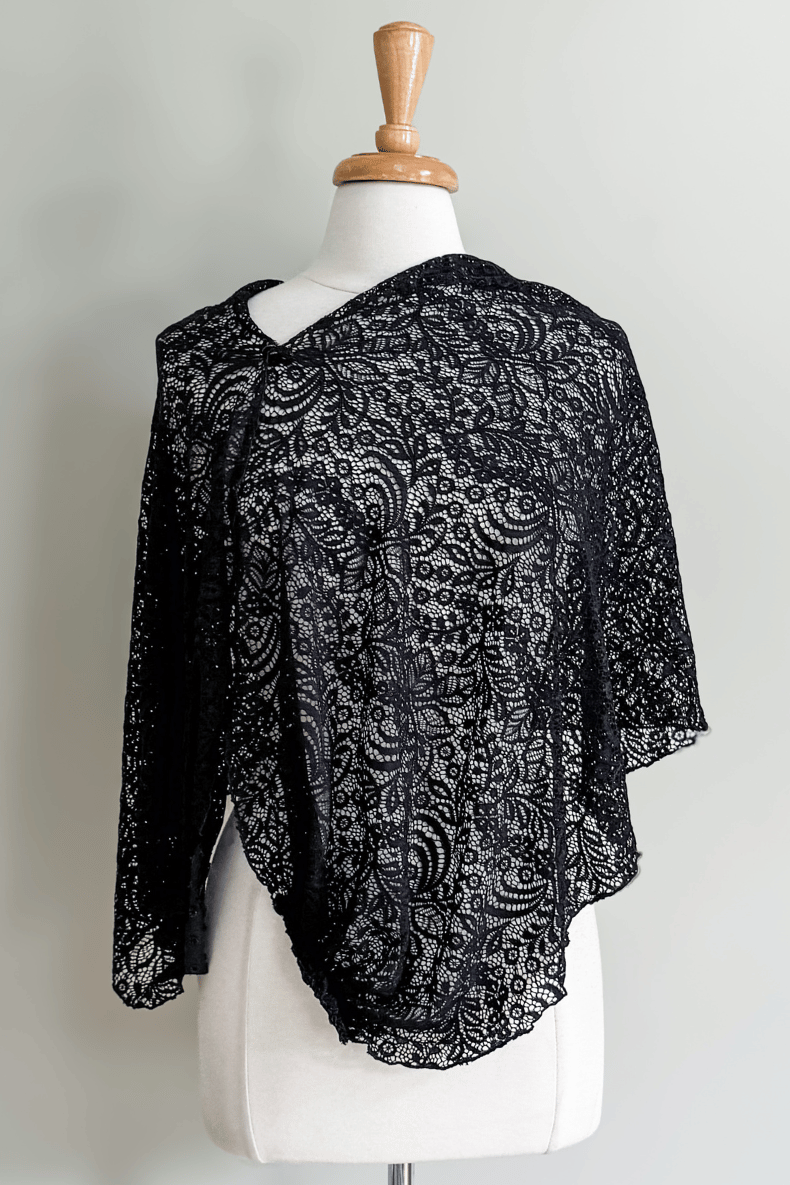 Diane Kroe Black Lace Mantilla Wrap styled as an elegant asymmetrical poncho