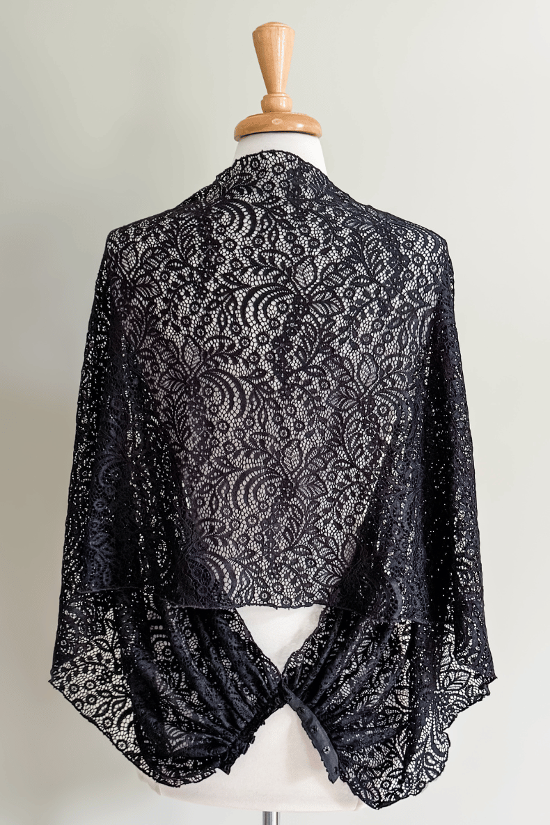 Diane Kroe Black Lace Mantilla Wrap styled as a sheer lace shawl, back view