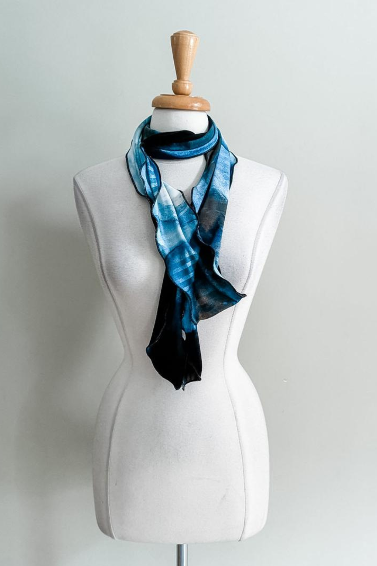 Sea Oasis print Sash worn as a scarf on a plain background