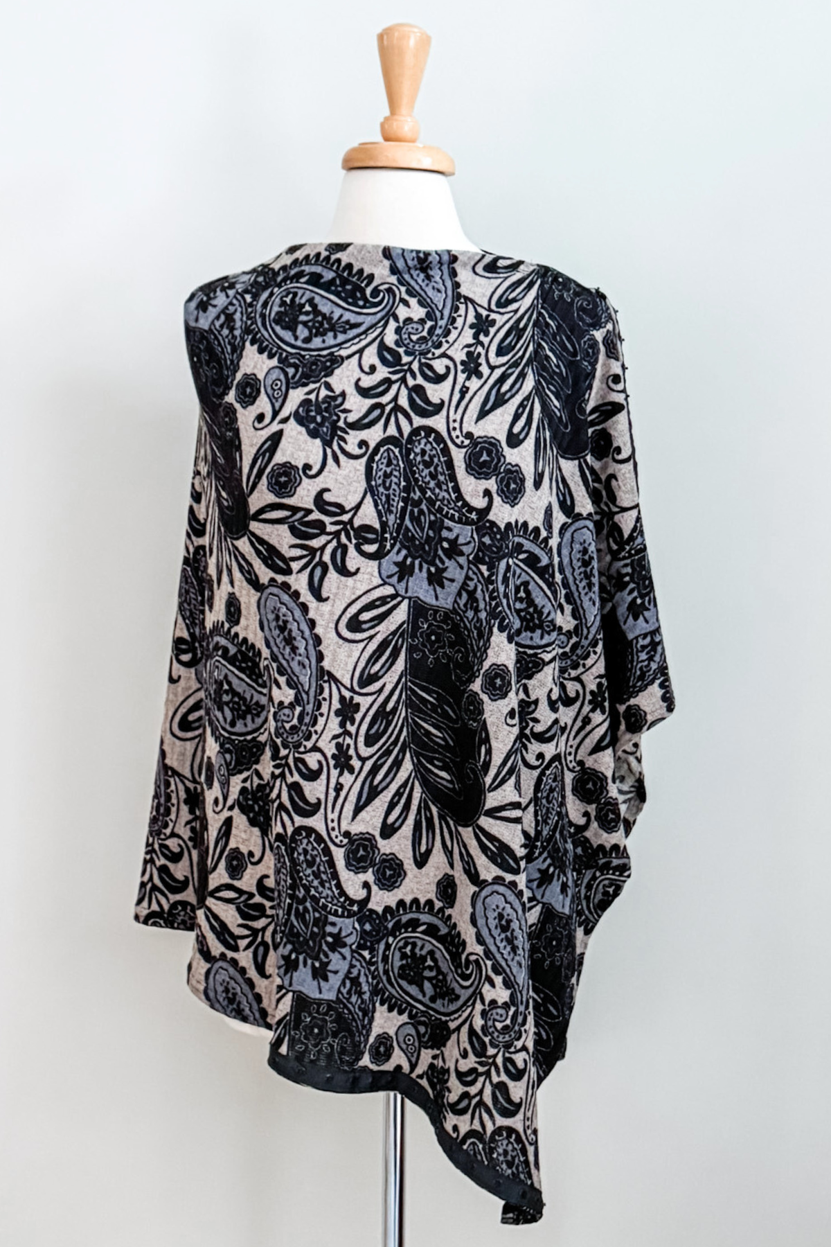 Diane Kroe Carry-on Cozy in blue Spain print styled as wrap top.