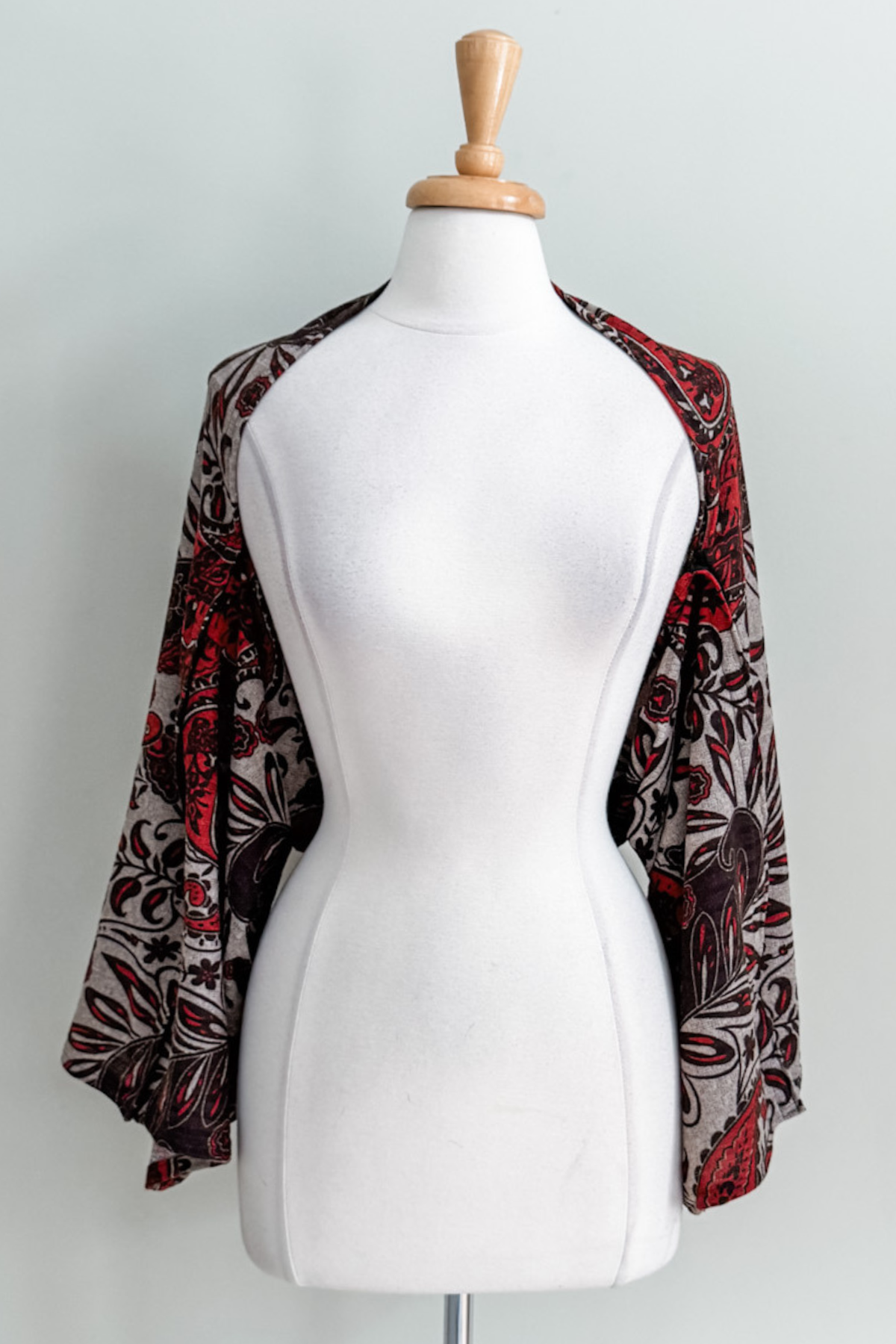 Diane Kroe Carry-on Cozy in red Spain print styled as cardigan.