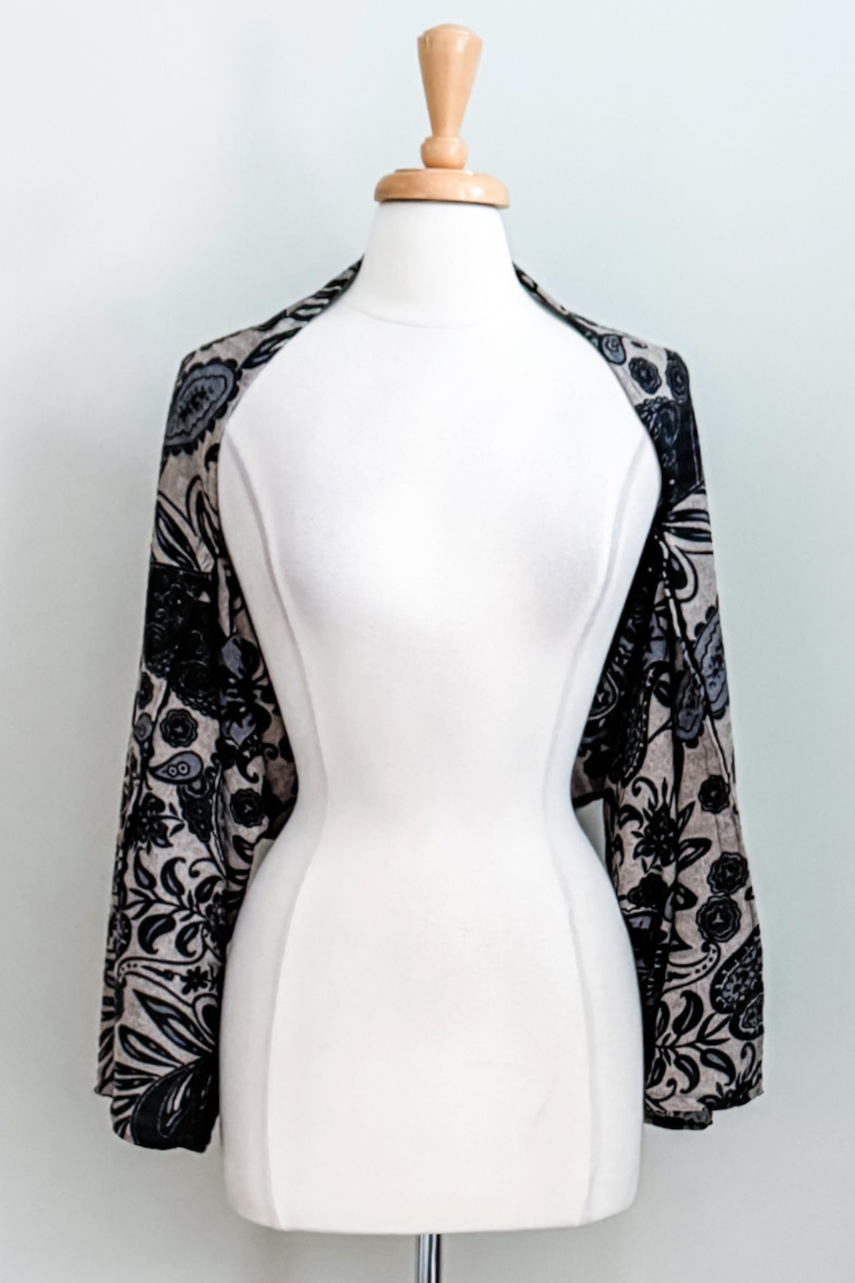 Diane Kroe Carry-on Cozy in blue Spain print styled as cardigan.