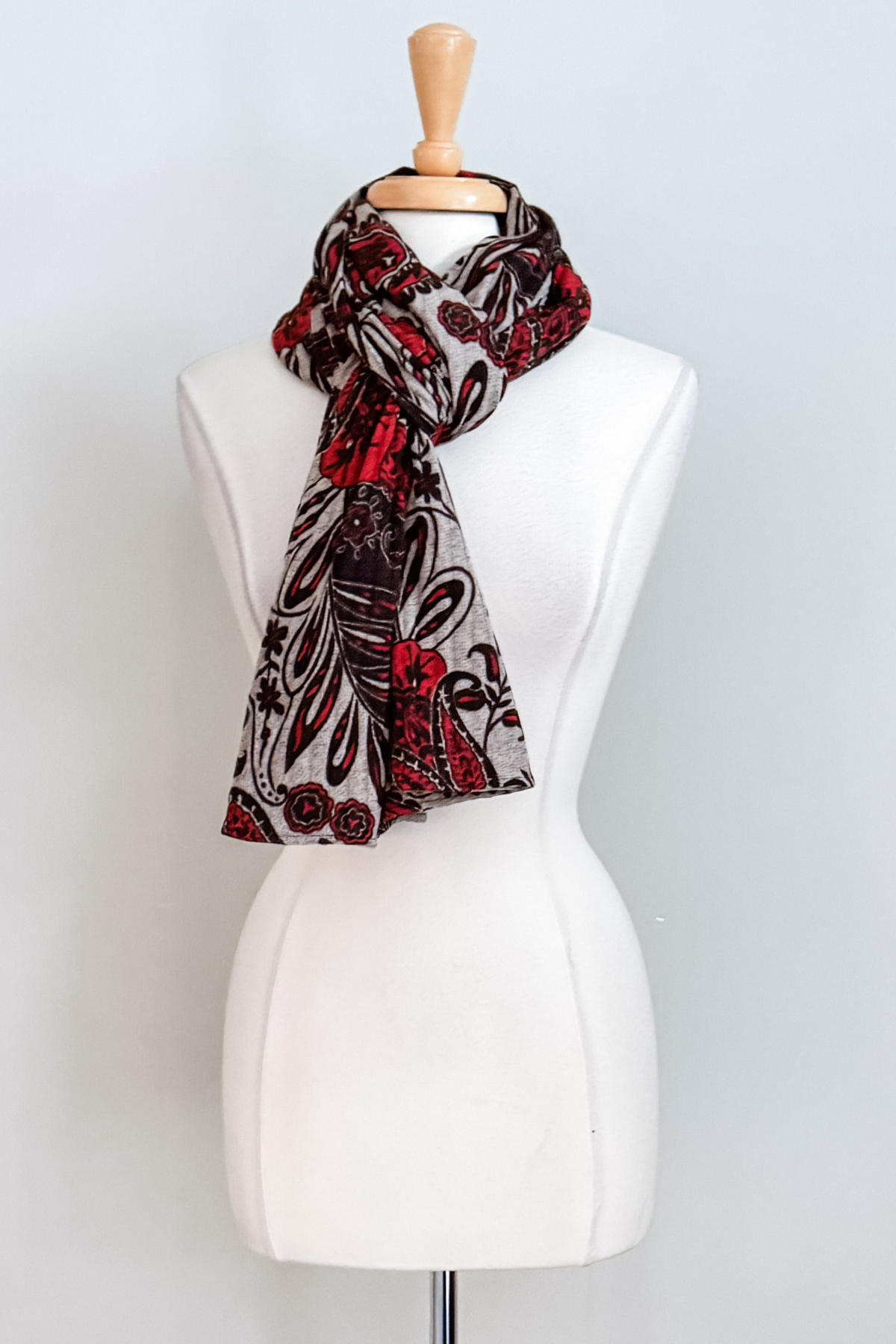 Diane Kroe Endless dress in red Spain print styled as scarf.
