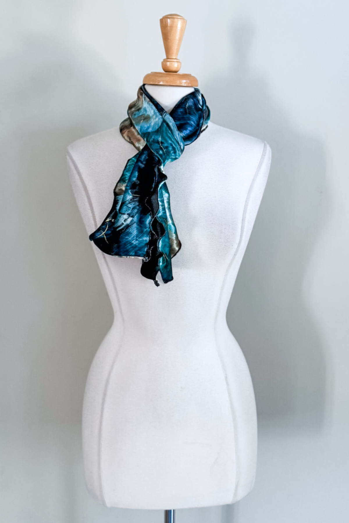 Turquoise marble-patterned sash worn as a scarf from Diane Kroe