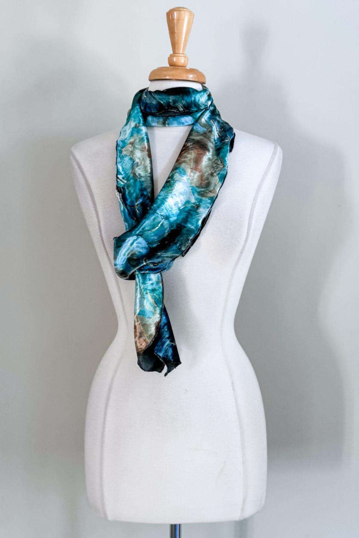 Turquoise marble-patterned sash worn as a scarf from Diane Kroe