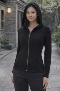 Woman wearing black knitted convertible hoodie travel outfit video