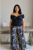 Diane Kroe navy cross top with flattering crossover design paired with blue Spain print PJ pants video.